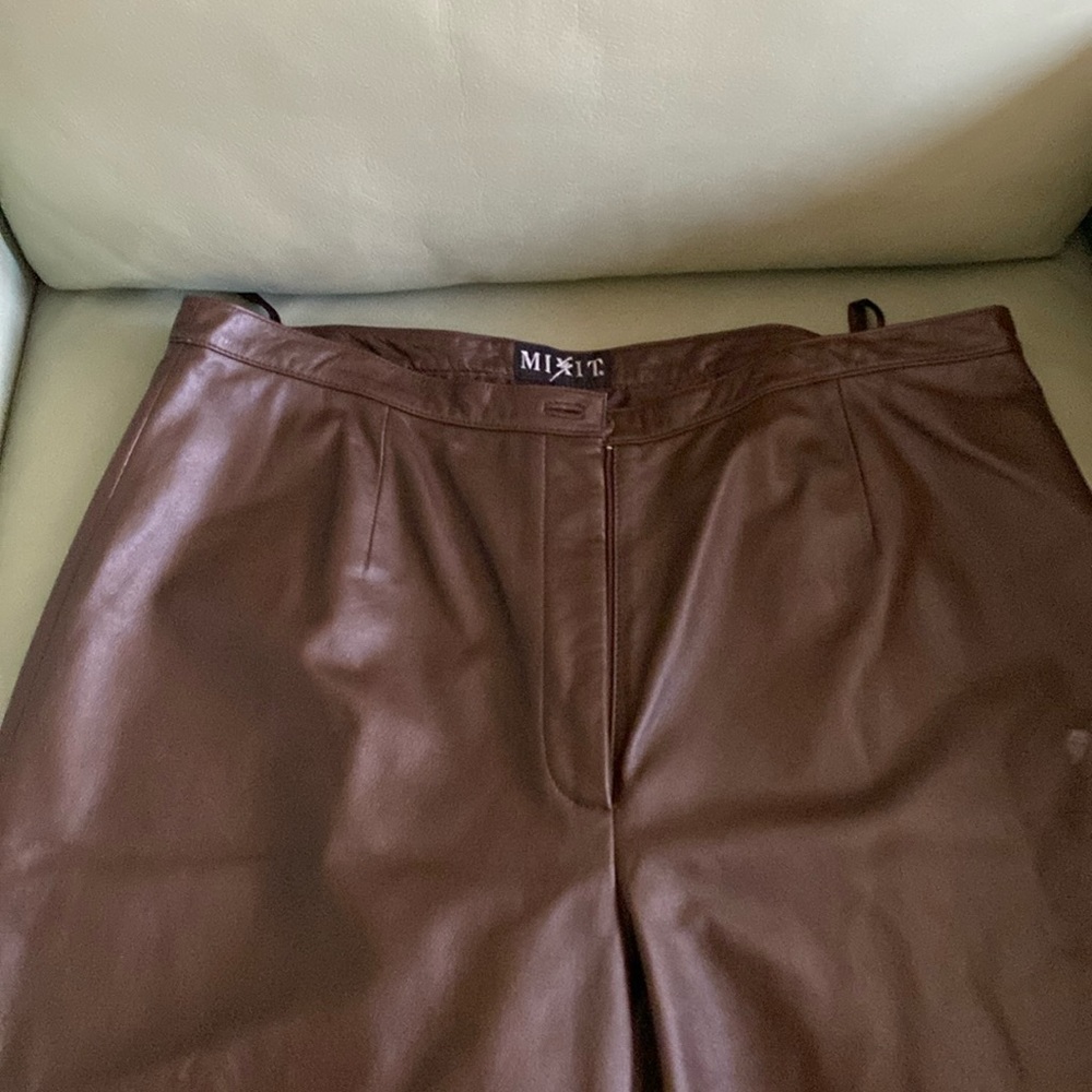 Leather women pants black pair and a brown pair size 16